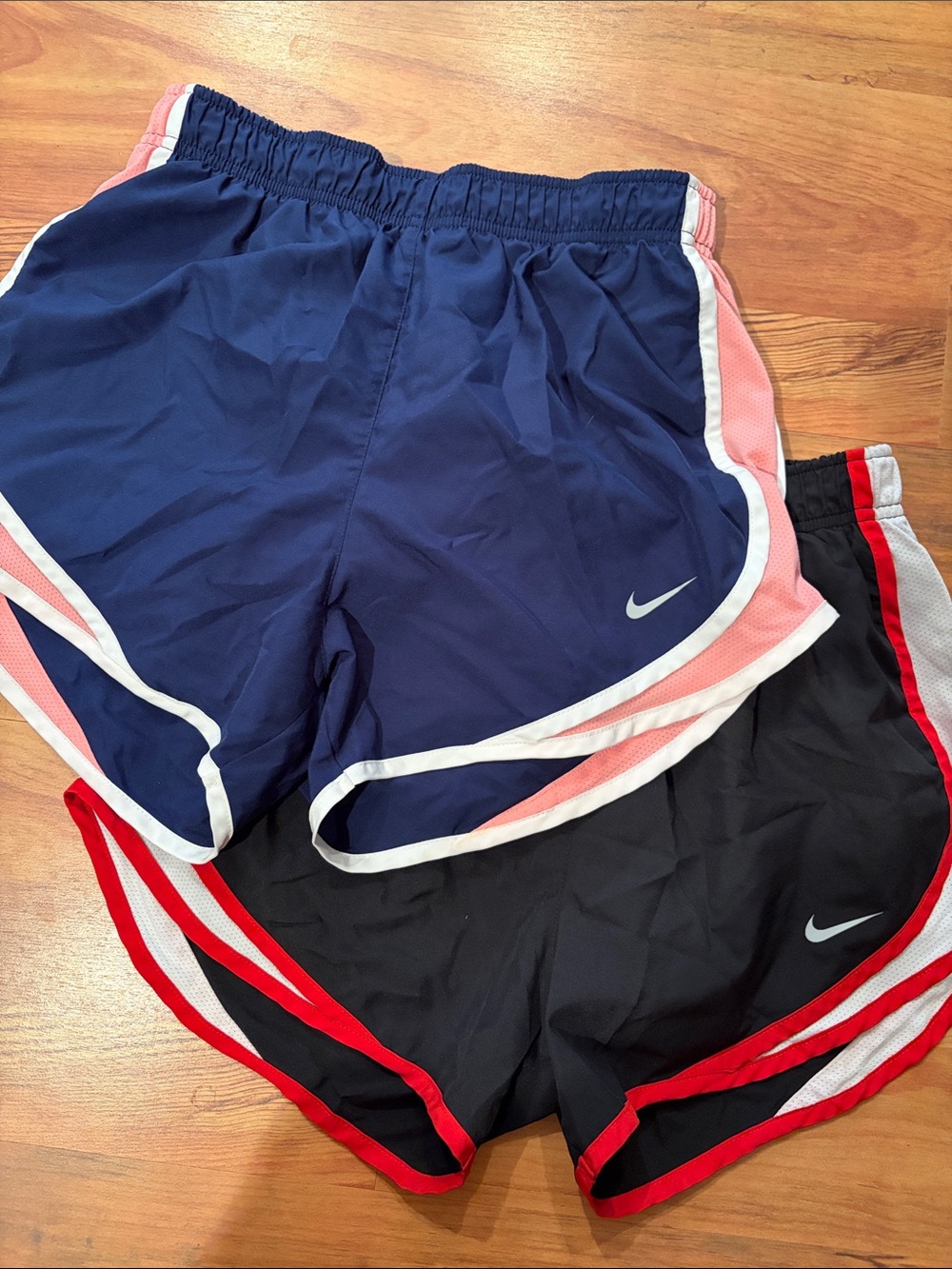 Nike Women's Navy Blue and Black Athletic Shorts with Pink and Red Trim